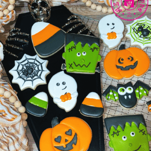 Halloween-themed cookies featuring pumpkins, ghosts, and candy corn.
