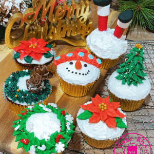 Festive Christmas-themed cupcakes with holiday decorations.